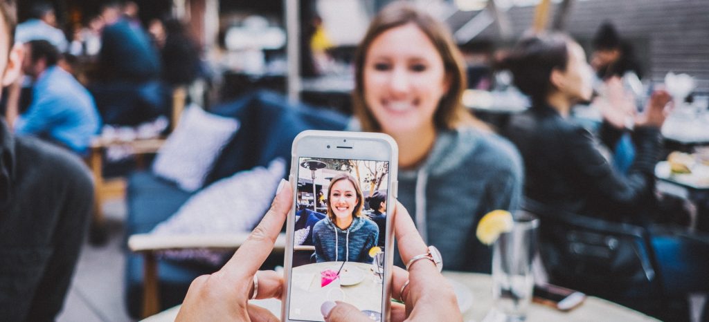 Image of woman taking photo