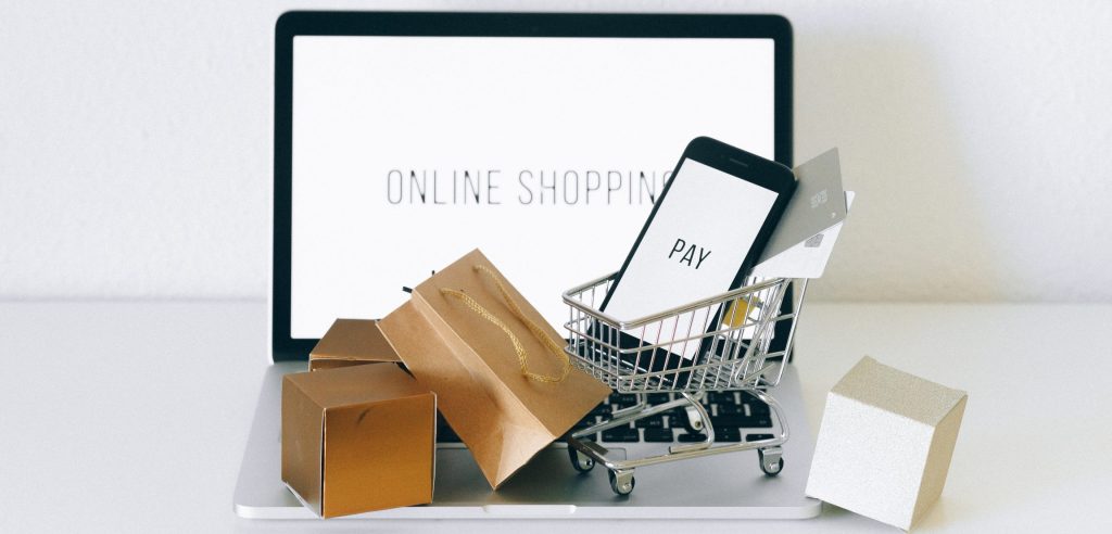 Brown cardboard box on gray shopping cart