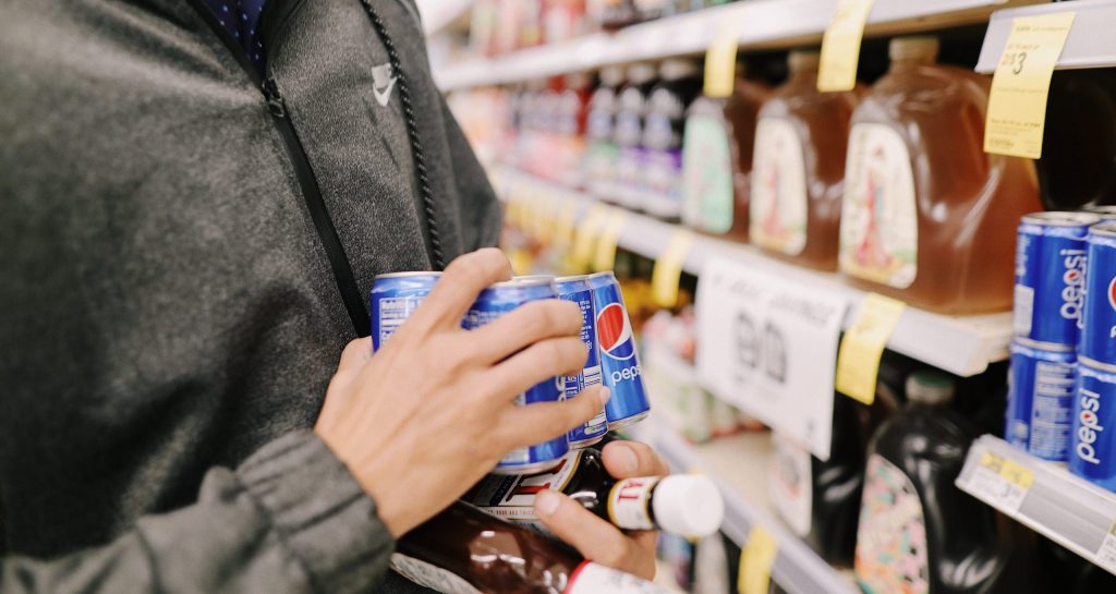 A person buying from a grocery